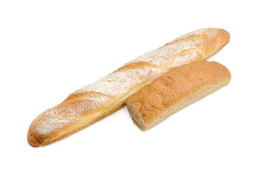 One whole fresh baguette and half loaf of the long bread with bran closeup on a light background
