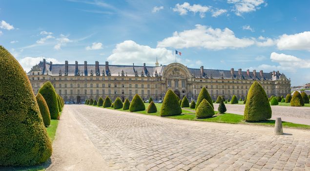 Esplanade des Invalides and northern facade of the Hotel Des Invalides with archway of a main entrance in Paris
