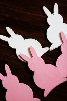 Easter decor. rabbits on the old wooden background. Celebratory background in rustic style. Spring. Close-up.