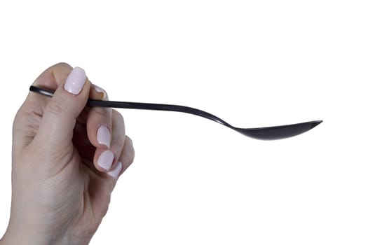 Female hand with a spoon on a white background