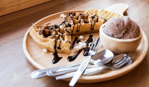 Belgian waffles with fruit and chocolate, forest fruit, all homemade, delicious batter.