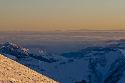 Snow peaks of the mountains in the evening