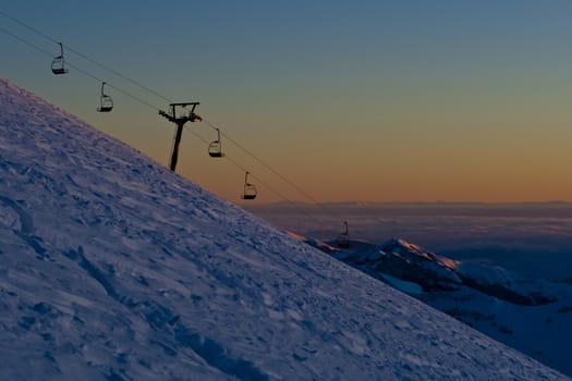 Snow peaks of the mountains in the evening