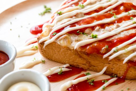 Pizza toasted bread with tomato sauce and ham cheese selective focus,