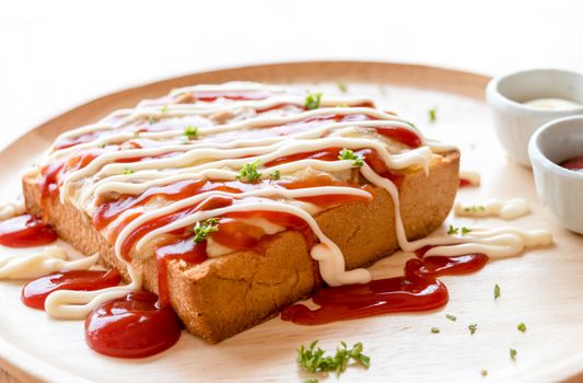 Pizza toasted bread with tomato sauce and ham cheese selective focus