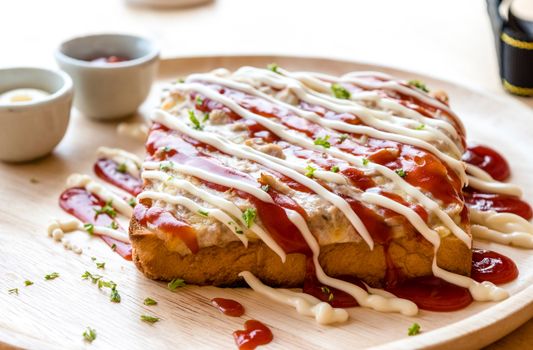 Pizza toasted bread with tomato sauce and ham cheese selective focus