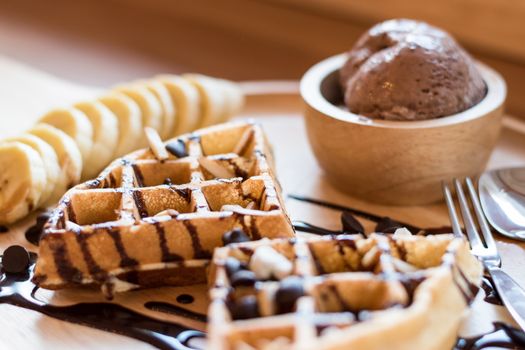 Belgian waffles with fruit and chocolate, forest fruit, all homemade, delicious batter