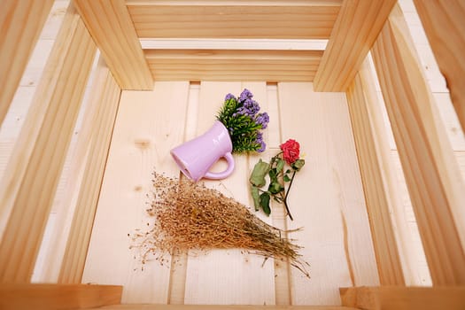 Close Up Wooden Box with Purple Little Flower in Pot