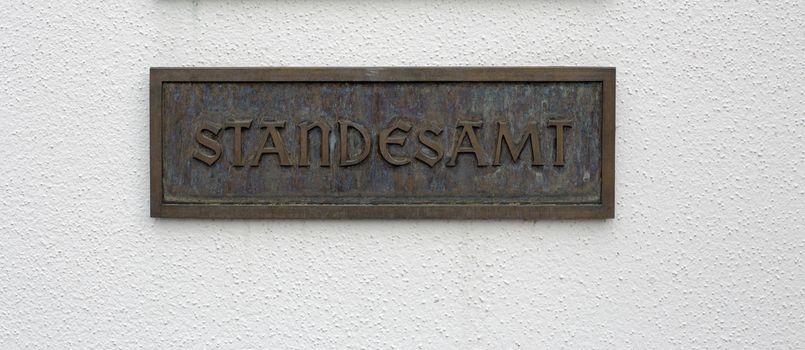 German sign with the german word for registry office on a wall