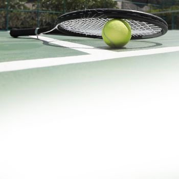 tennis racket and ball on the tennis court