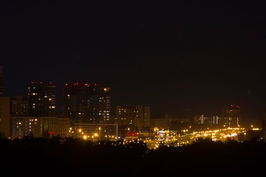 night city view. yellow illumination and skyscapers