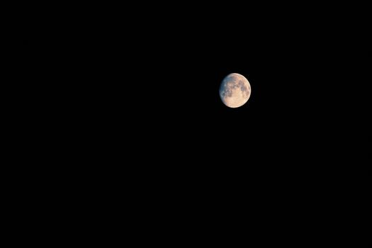 toned image of a moon. a lot of copy space