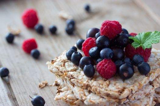 Bread topped with fresh fruit and mint leaf