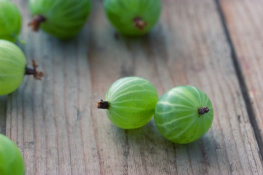 Gooseberries on the wooden table. close up