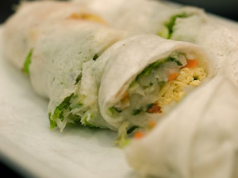 VEGETABLE SPRING ROLLS ON WHITE PLATE