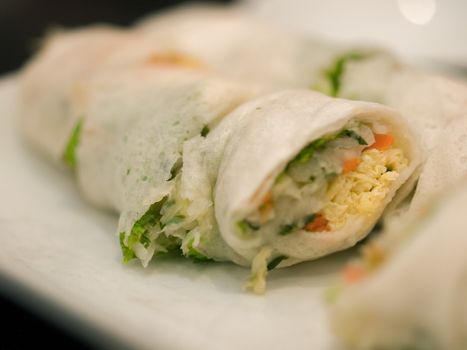 VEGETABLE SPRING ROLLS ON WHITE PLATE