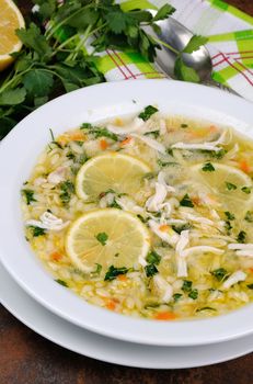 Avgolemono, greek   chicken soup with egg-lemon sauce, orzo and fresh parsley leaves