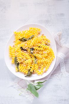 Fusilli pasta with sage and pine nuts. Gluten free. Flour from rice and corn flour