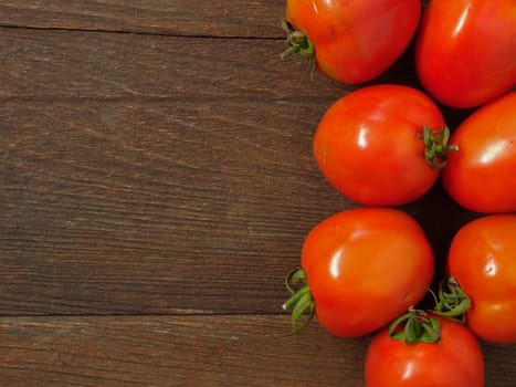 tomatoes  on wooden background