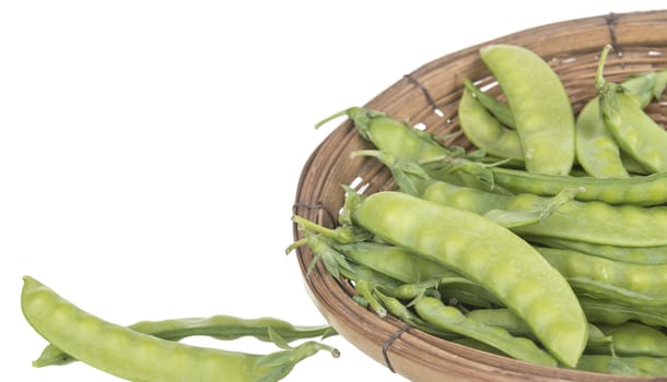 String bean in a basket isolated on a white background.