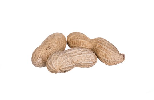 Peanuts dried in closeup isolated on white background.