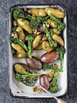 close up of a tray of potato broccolini salad