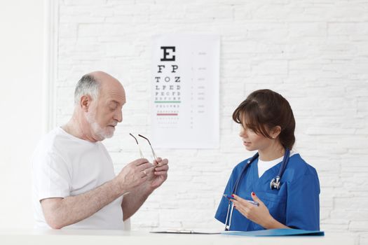 Doctor making vision test for new glasses