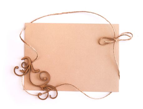 Sheet of kraft paper and a frame of linen thread and space for text