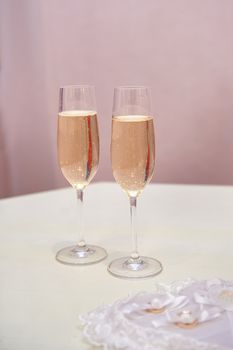 Two glasses of champagne on the table for the wedding ceremony.