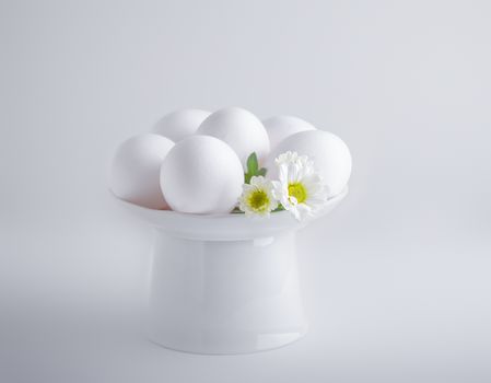 Eggs with flowers on a white background. Easter Symbols