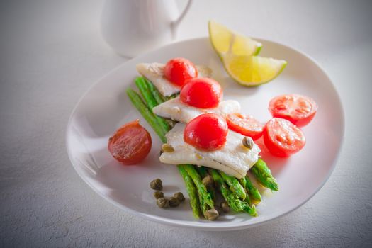 Mackerel fillets with asparagus lemon and tomato