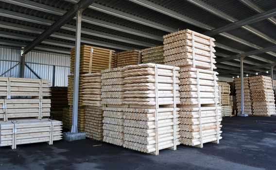 stacks of lumber for the construction of stacked in a warehouse