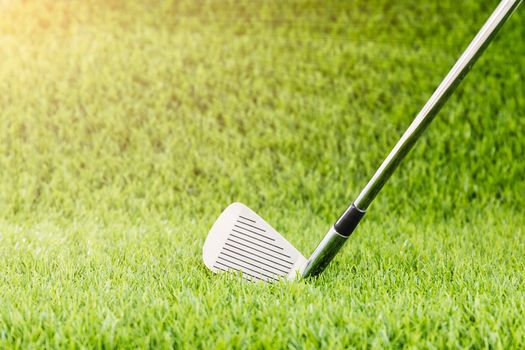 Close up Golf club on green grass in golf course with copy space