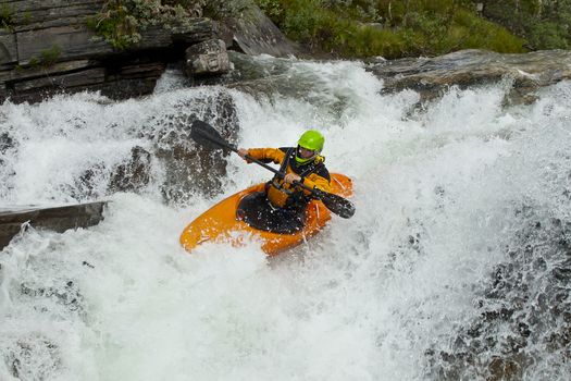 Kayaker in the waterfall in Norway, Ula river