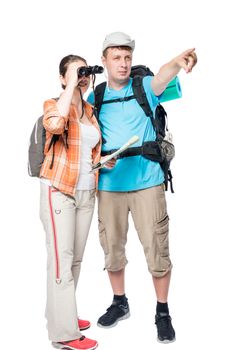 man shows the direction of a hike woman with binoculars on a white background