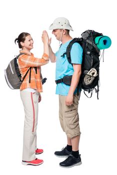 couple travelers with backpacks on a white background