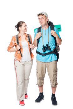smiling travelers with backpacks on a white background