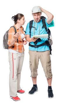 young couple can not agree on the travel route on a white background