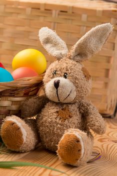 basket with colored eggs and the Easter Bunny for Easter