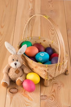 Easter still life with bunny and basket with eggs