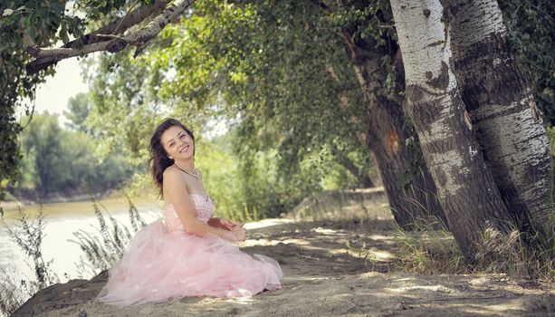 young pretty woman in forest in spring time