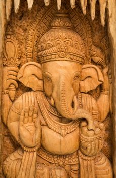 wood carving for Hindu god Ganesha on the wood.