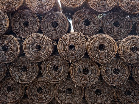 Stacked steel wire roll ready for construction.