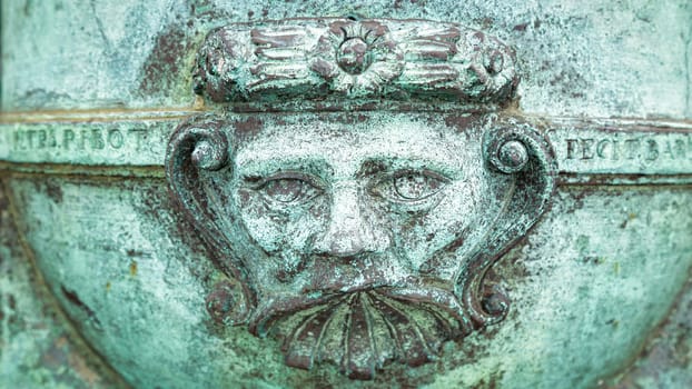 A Metal Face on an Old Cannon, Color Image, Day