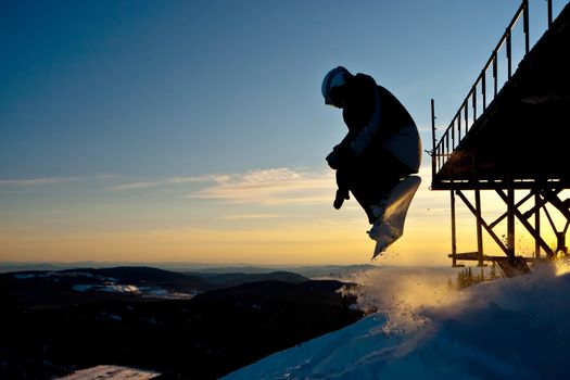 The snowboarder jumping from the bridge in Siberia