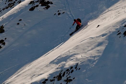 The young man skiing in the Caucasus mountains