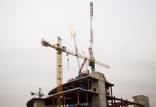 Construction of multi-storey residential buildings, cranes,moscow,day