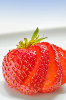 Strawberry slices cut on a white background