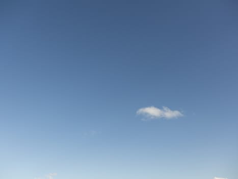 blue sky with a single cloud on the right side