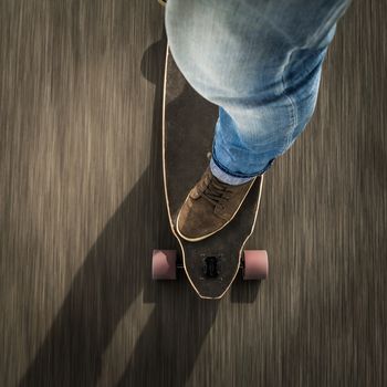 Detail of a young man feet riding a skateboard